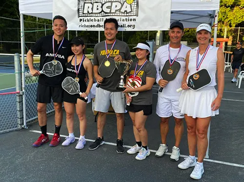Diane with nationally-ranked players at a Richmond Pickleball Association tournament