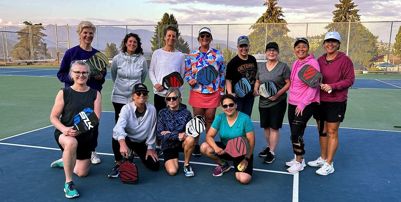 Maggie with a group of 11 pickleball after a pickleball clinic in West Vancouver, BC